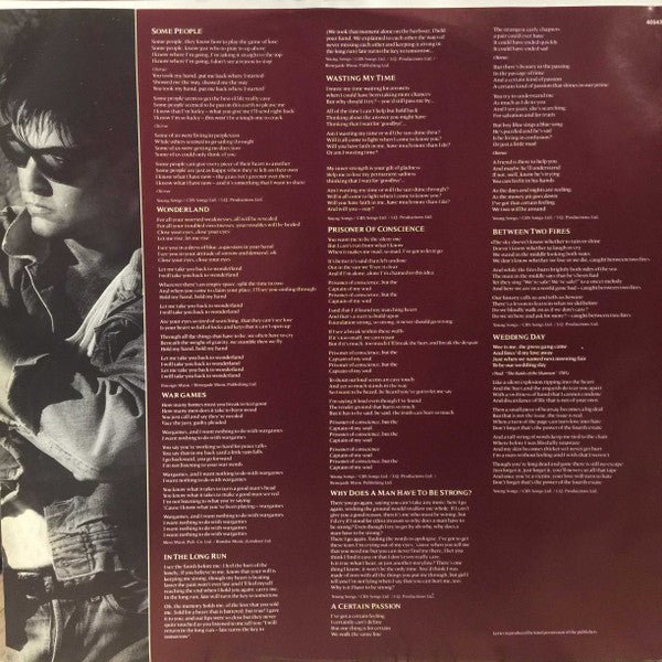 Paul Young - Between Two Fires (LP Tweedehands)
