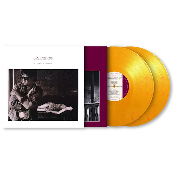 Paul Young - Between two fires (LP) - Discords.nl