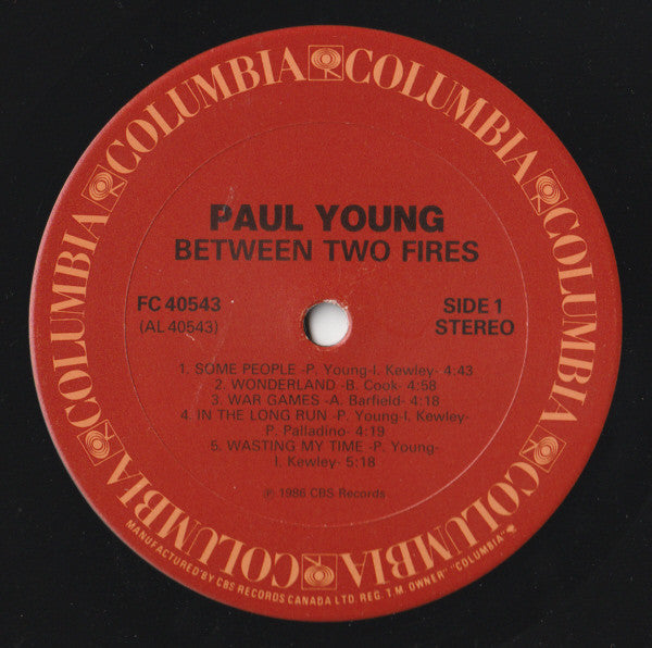 Paul Young - Between Two Fires (LP Tweedehands)