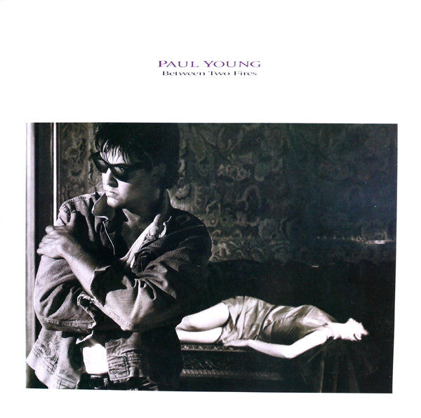 Paul Young - Between Two Fires (LP Tweedehands)
