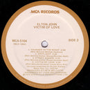 Elton John : Victim Of Love (LP, Album, Tan)
